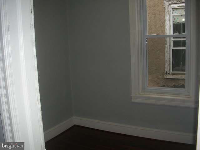 spare room featuring baseboards