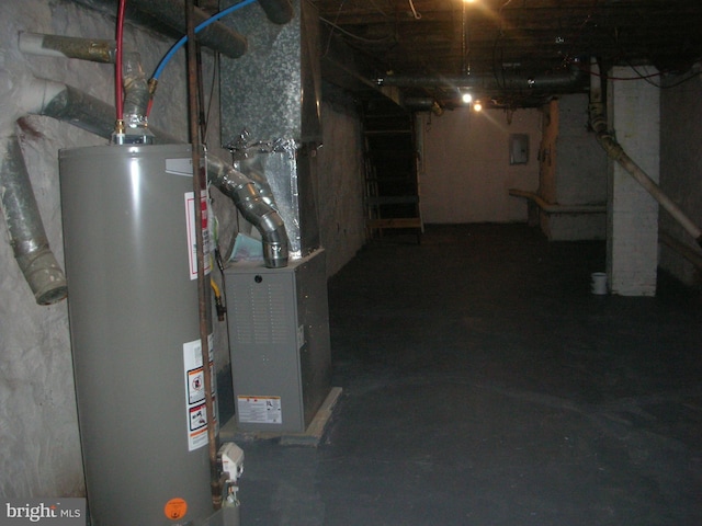 interior space featuring electric panel and gas water heater