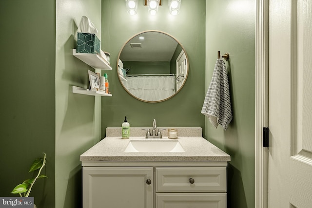 bathroom with visible vents and vanity