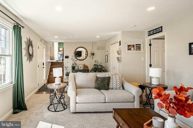 carpeted living room featuring recessed lighting and baseboards