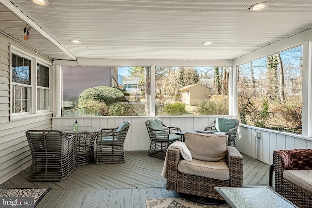 sunroom / solarium featuring a healthy amount of sunlight