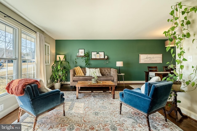 living room with wood finished floors and baseboards