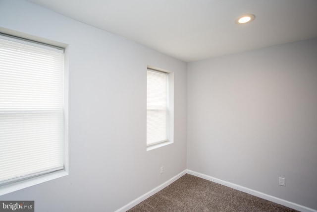 carpeted spare room with recessed lighting and baseboards