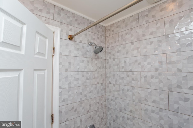 full bathroom with tiled shower