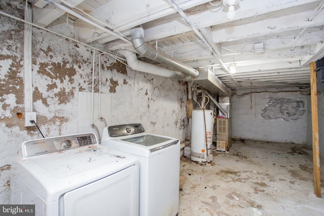 washroom with heating unit, laundry area, water heater, and washing machine and clothes dryer