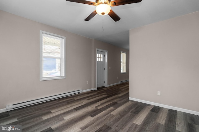 unfurnished room with a baseboard radiator, baseboards, dark wood finished floors, and baseboard heating