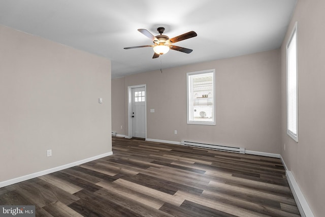 unfurnished room with a baseboard heating unit, dark wood-style floors, a ceiling fan, and baseboards