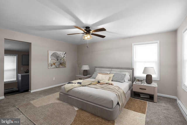 carpeted bedroom featuring a baseboard heating unit, a ceiling fan, and baseboards