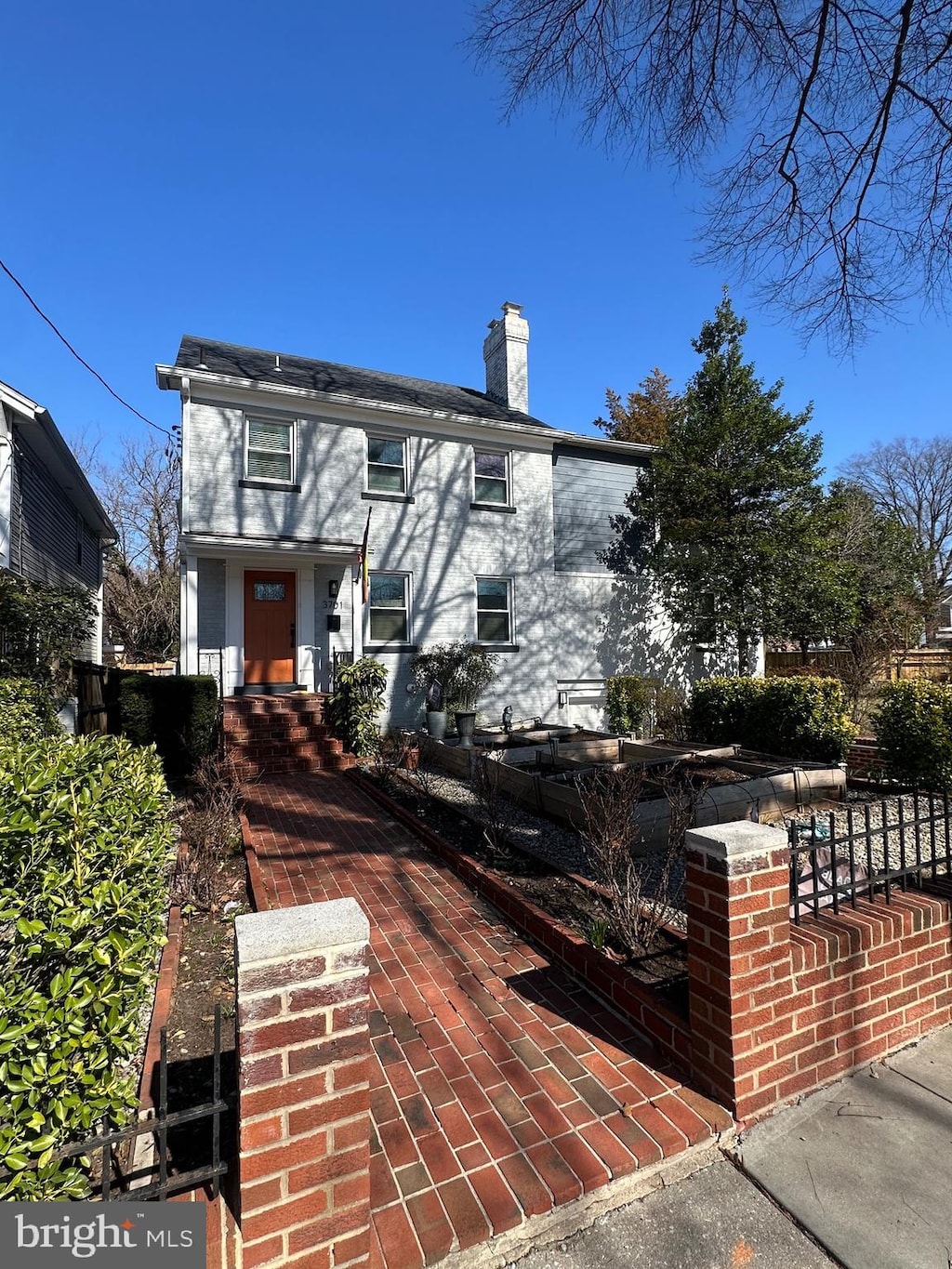 view of front of property featuring a chimney