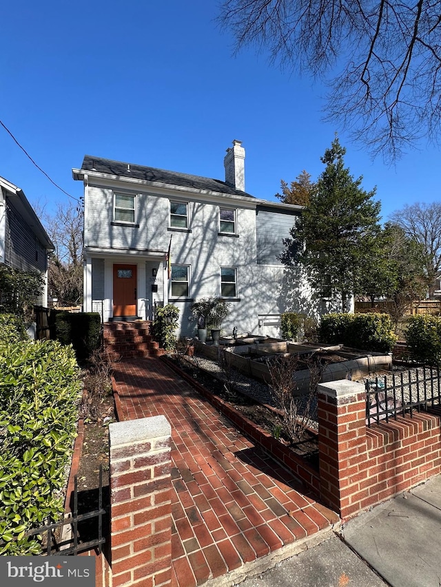 view of front of property featuring a chimney