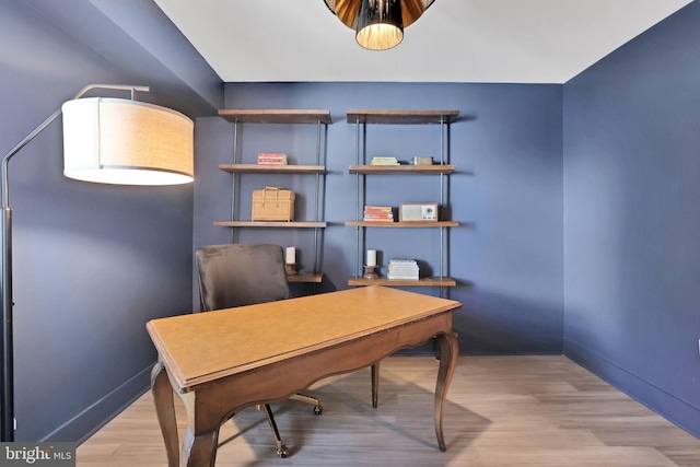 office with baseboards and wood finished floors