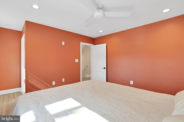 bedroom with baseboards, ceiling fan, wood finished floors, and recessed lighting