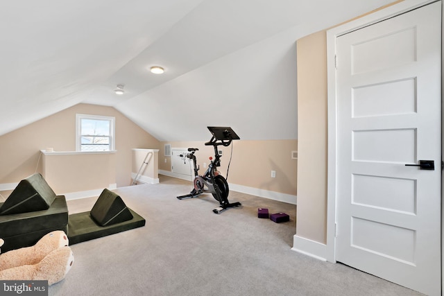 workout room featuring baseboards, carpet flooring, and lofted ceiling