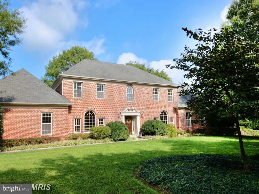 10506 Milkweed Dr, Great Falls, VA 22066 - view of front of home with a front lawn and brick siding