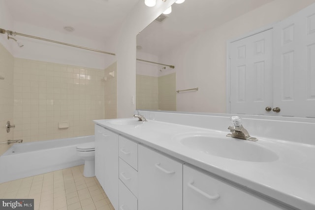 full bathroom featuring a sink, shower / bathing tub combination, toilet, and tile patterned floors