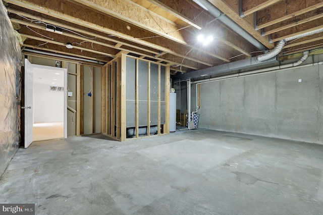 unfinished below grade area featuring gas water heater