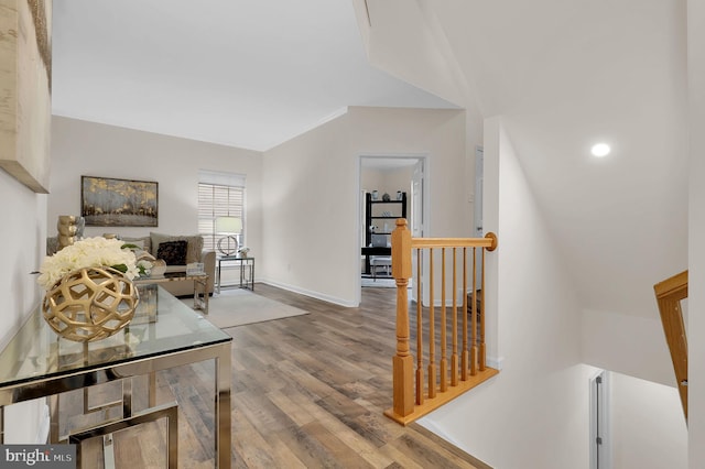 interior space featuring wood finished floors and baseboards