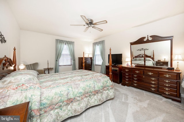 bedroom featuring light carpet and ceiling fan