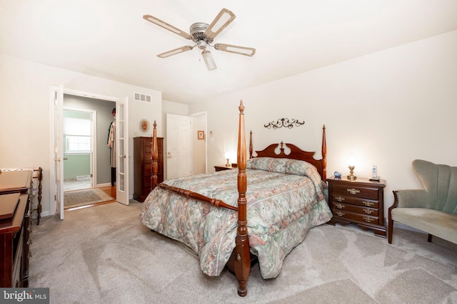 bedroom with carpet flooring, a ceiling fan, visible vents, and baseboards