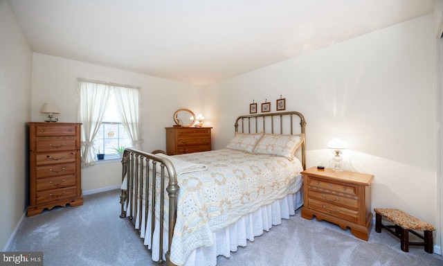 carpeted bedroom with baseboards