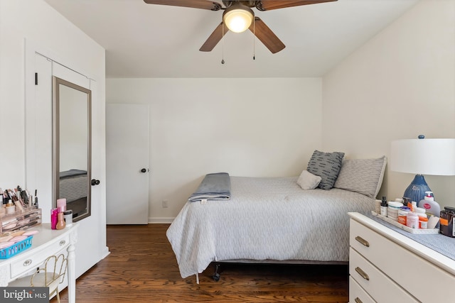 bedroom featuring dark wood-style floors and ceiling fan