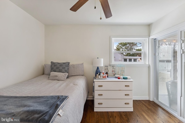 bedroom with ceiling fan and dark wood-type flooring