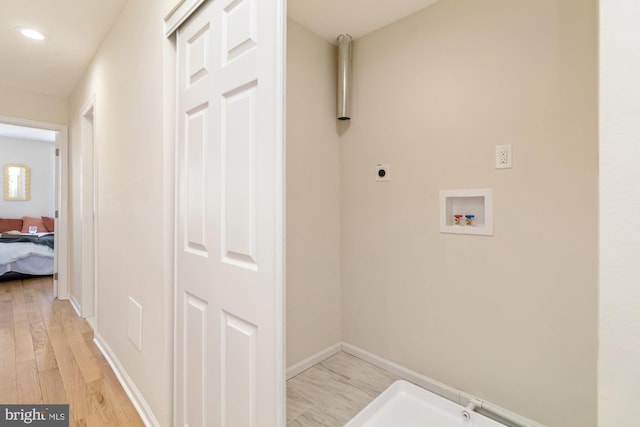 washroom featuring baseboards, hookup for an electric dryer, recessed lighting, washer hookup, and light wood-type flooring