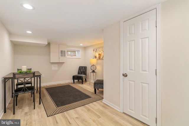 sitting room with recessed lighting, baseboards, and light wood-style floors