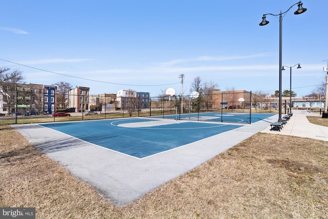 view of basketball court featuring community basketball court and fence