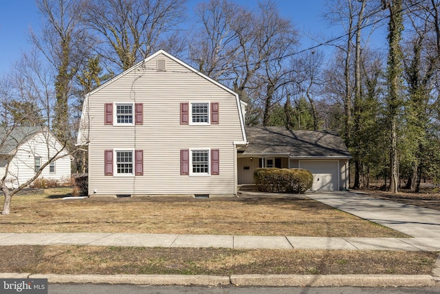 view of front of property featuring a garage, a gambrel roof, concrete driveway, and a front yard