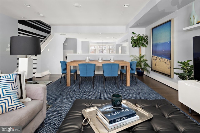 living room featuring recessed lighting, stairway, and wood finished floors