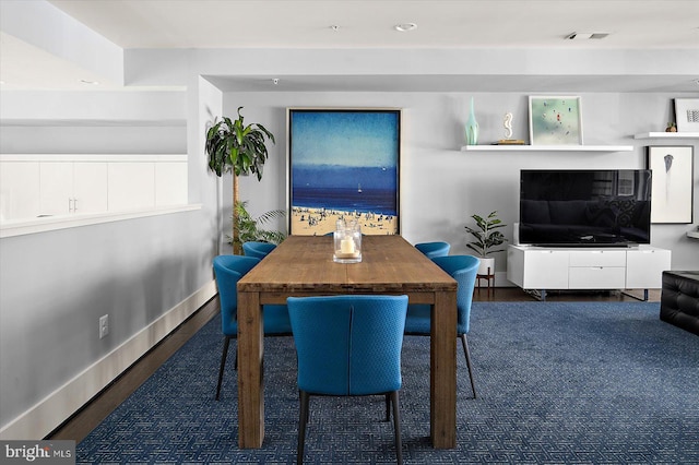 dining space featuring recessed lighting, baseboards, and wood finished floors