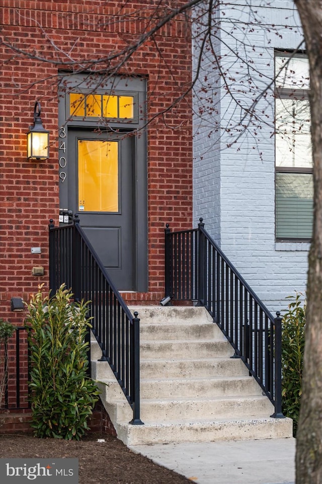 property entrance with brick siding