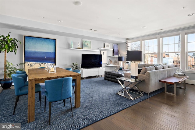 living area with recessed lighting and wood finished floors