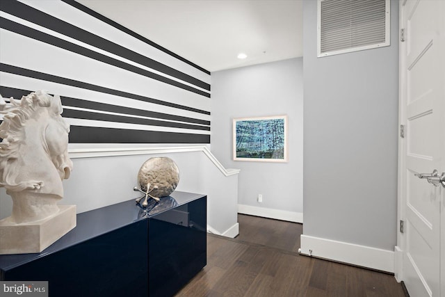 interior space featuring recessed lighting, dark wood-style flooring, and baseboards