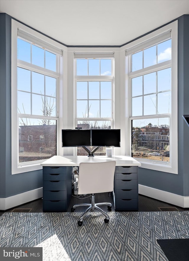 office space with baseboards