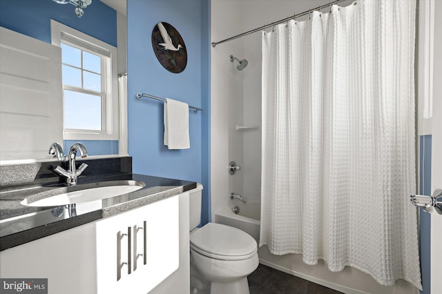 bathroom featuring toilet, shower / bath combo, tile patterned flooring, and vanity