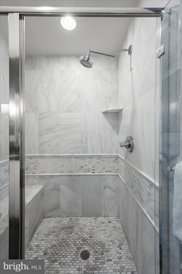 full bathroom with a shower stall