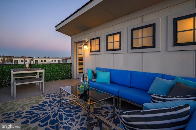 view of patio with an outdoor hangout area and a balcony