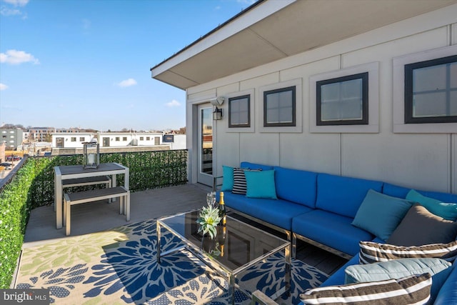 view of patio / terrace with an outdoor hangout area and a balcony