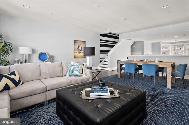 living room with recessed lighting, baseboards, and stairs