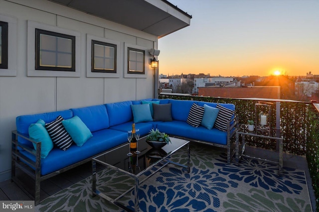 exterior space with outdoor lounge area and a balcony