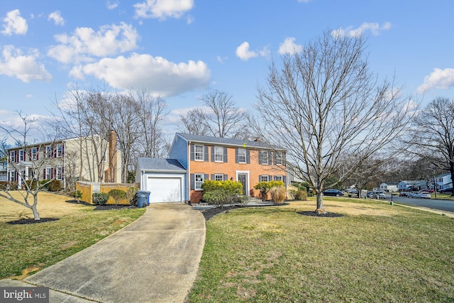 view of front of property featuring a garage, driveway, a chimney, and a front lawn