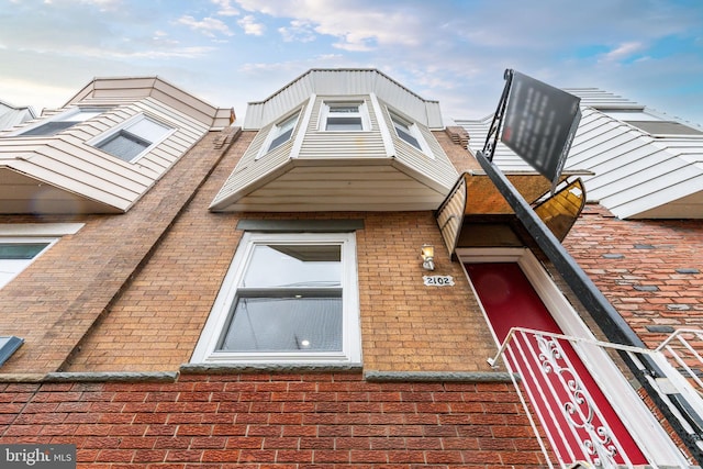 view of front of house featuring brick siding