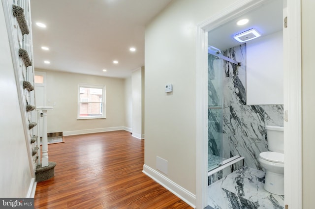 interior space with toilet, recessed lighting, visible vents, and a marble finish shower