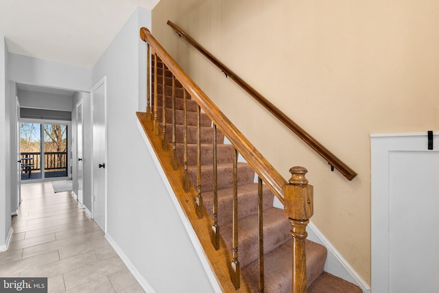 stairs featuring baseboards