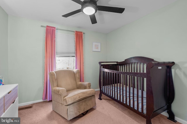 bedroom featuring visible vents, a ceiling fan, baseboards, and carpet floors