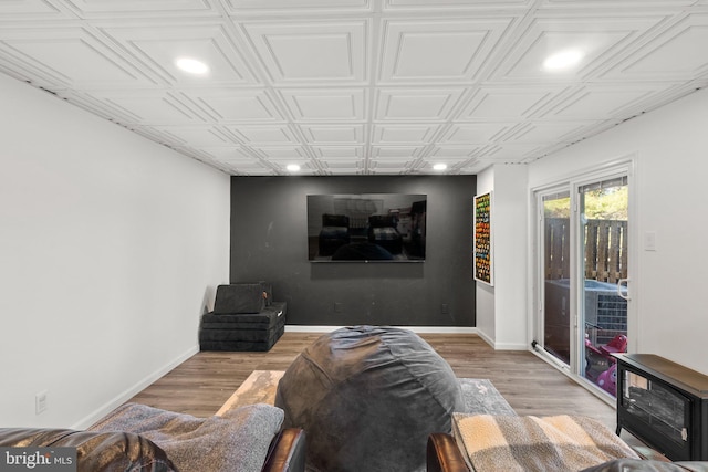 home theater featuring recessed lighting, baseboards, and wood finished floors