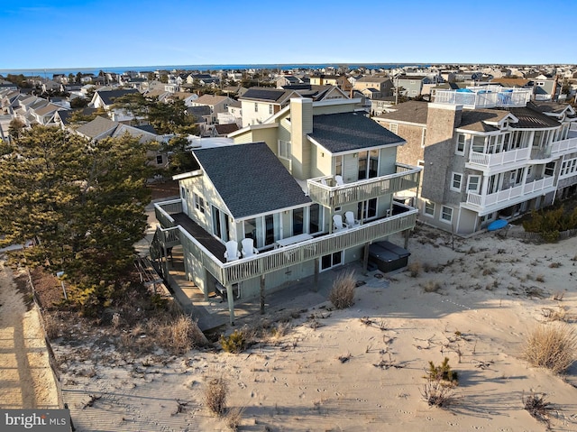 birds eye view of property with a residential view