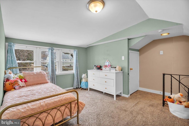 bedroom with carpet, vaulted ceiling, and baseboards